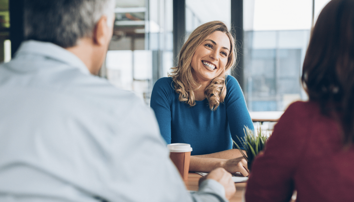 Insurance agent smiling at clients